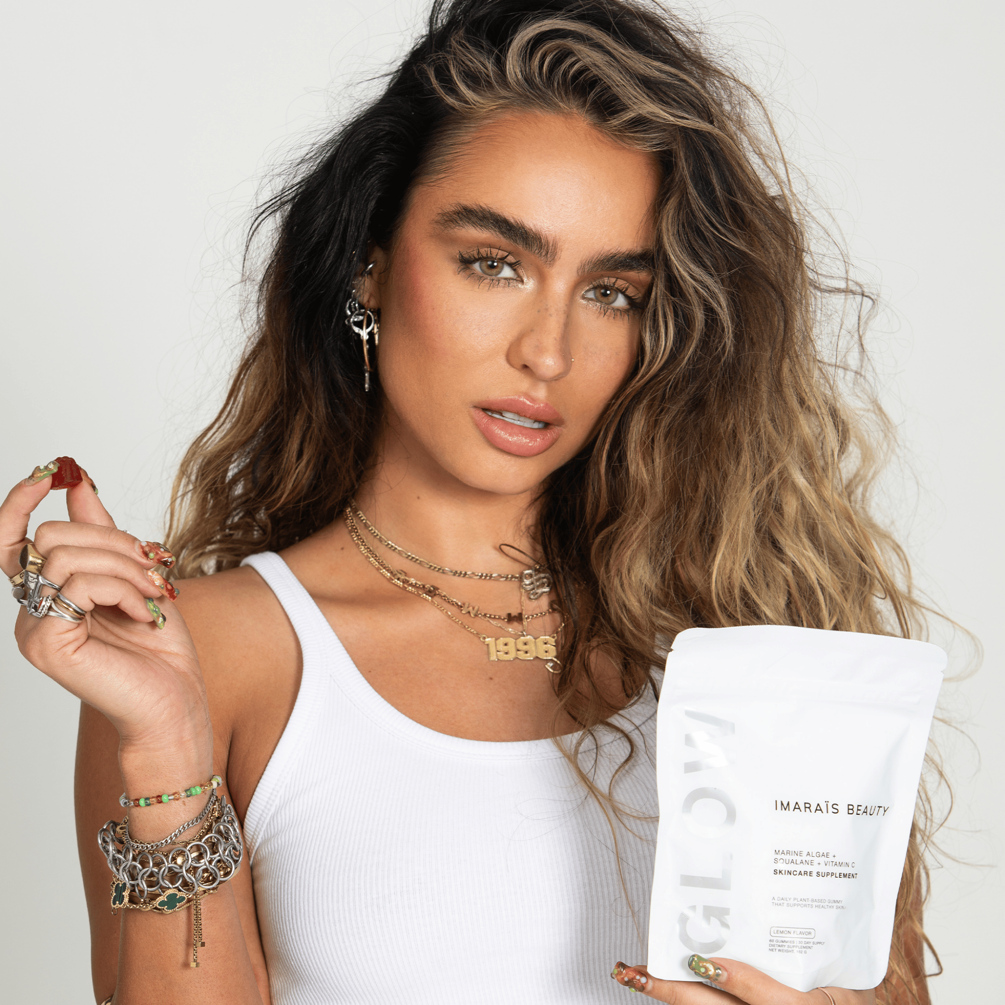 Before and after 4 weeks using Imarais Glow skincare gummies, showing smoother, more hydrated skin. Product pouch shown with 'Boost Collagen & Hydrate Skin*' text.